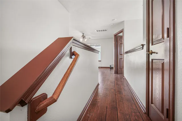 a view of balcony with wooden floor