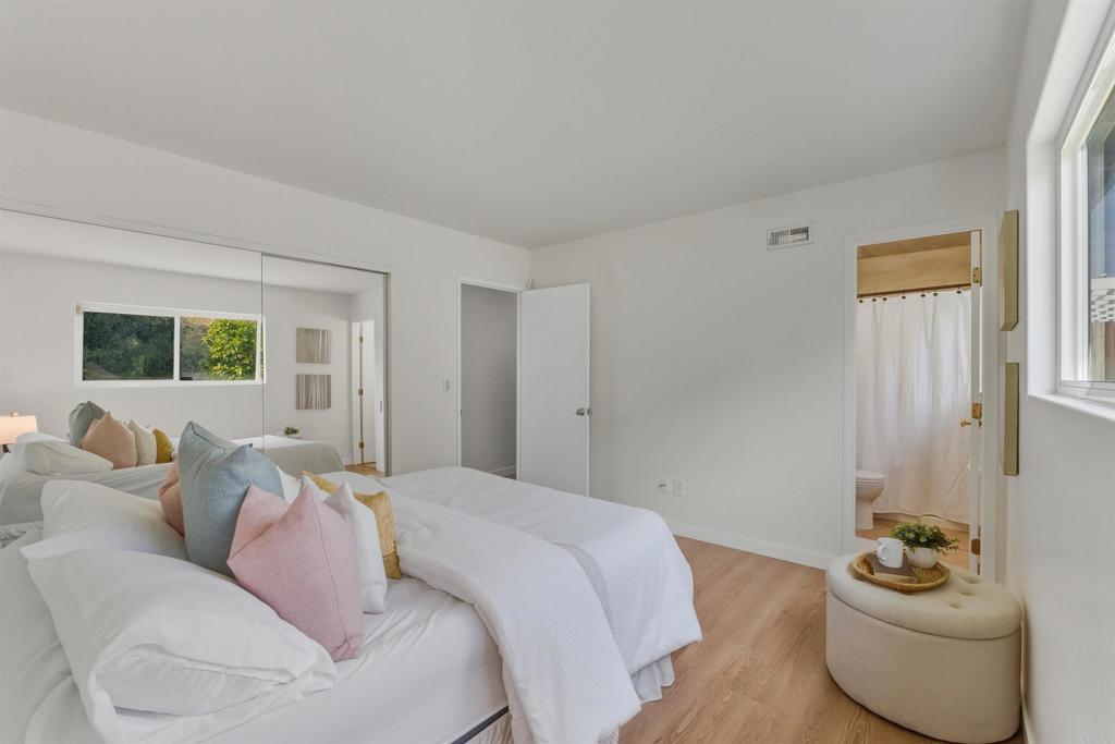 9909 Halberns Boulevard Santee, CA 92071 - Photo 14 of 35 a bed room with a bed and a couch