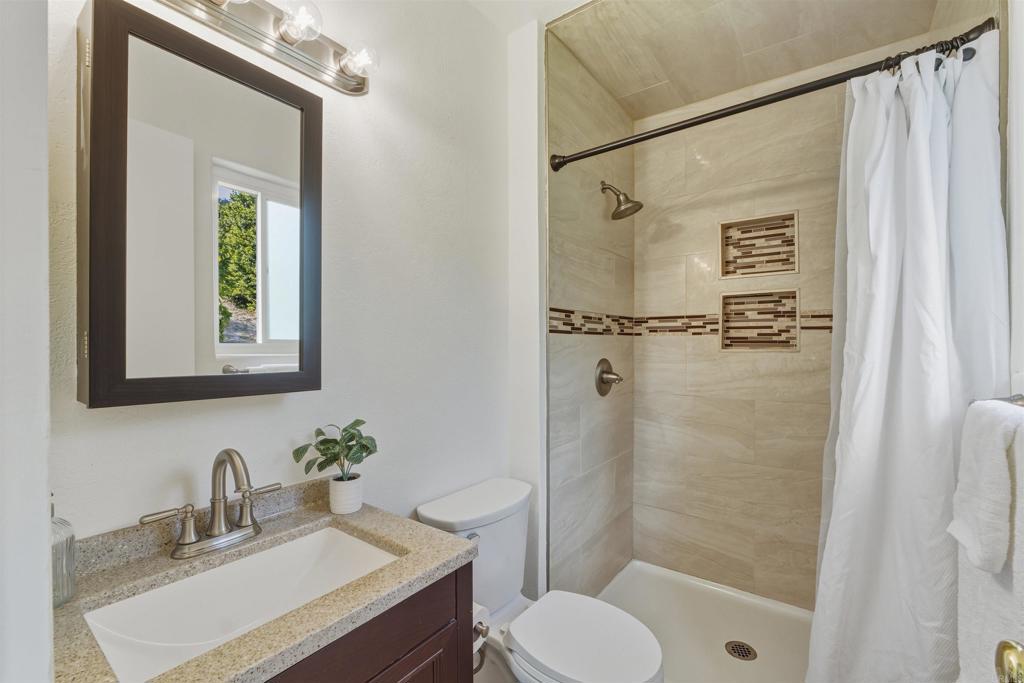 9909 Halberns Boulevard Santee, CA 92071 - Photo 15 of 35 a bathroom with a sink toilet and shower