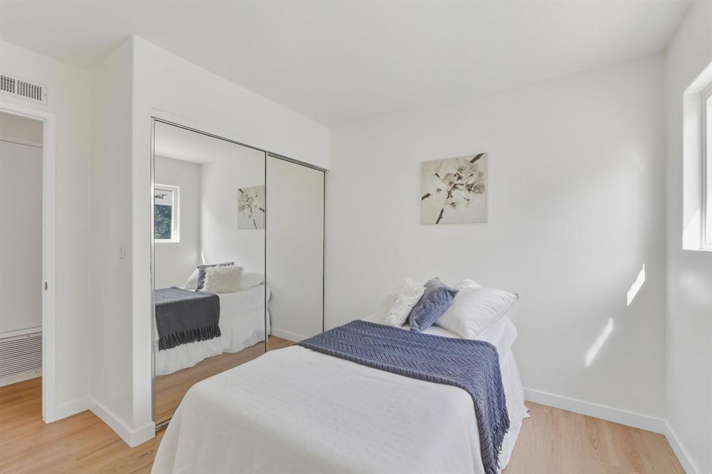 9909 Halberns Boulevard Santee, CA 92071 - Photo 18 of 35 a bedroom with a bed and hallway