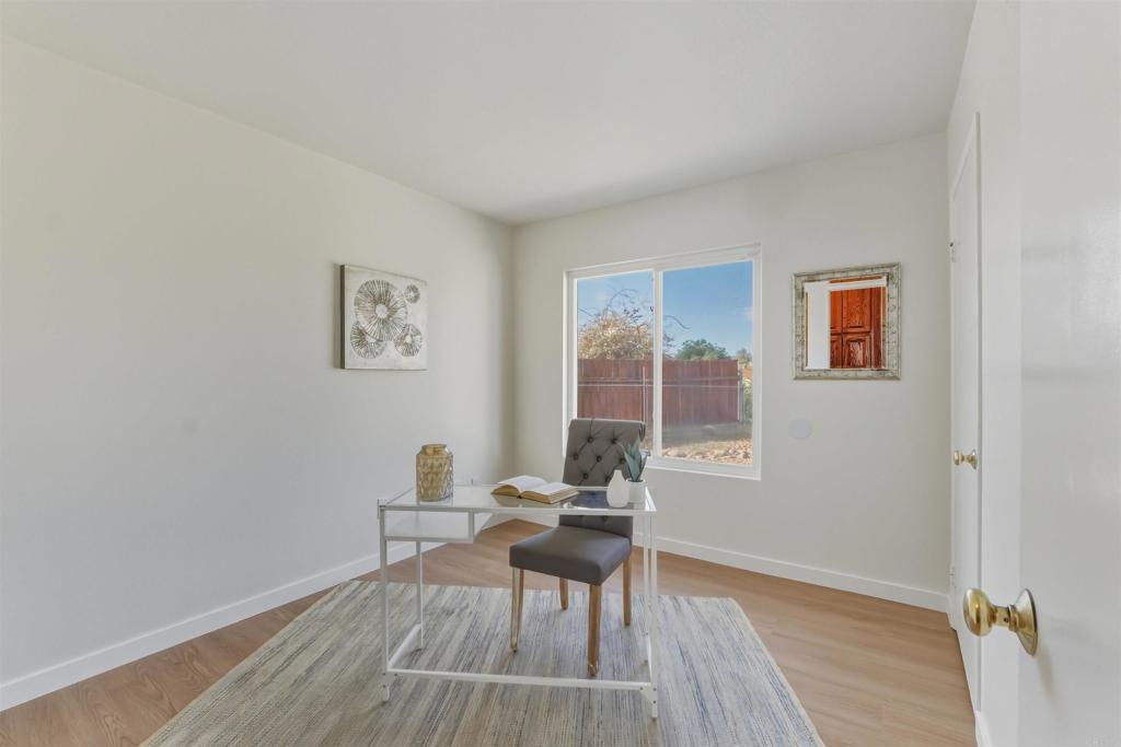 9909 Halberns Boulevard Santee, CA 92071 - Photo 19 of 35 a workspace room with wooden floor and a window