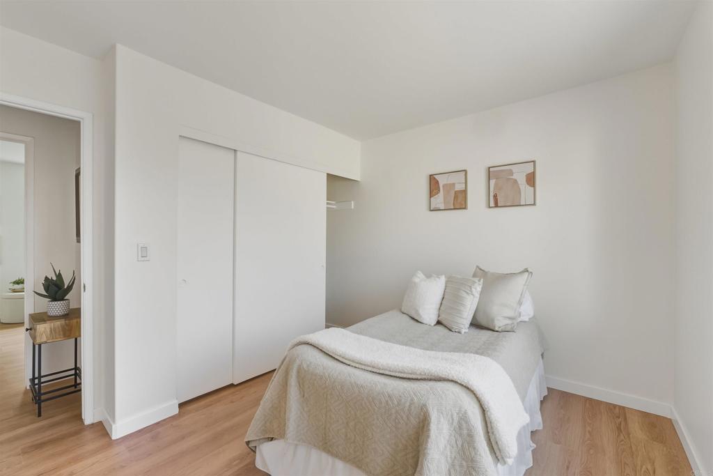 9909 Halberns Boulevard Santee, CA 92071 - Photo 23 of 35 a bedroom with a bed and wooden floor