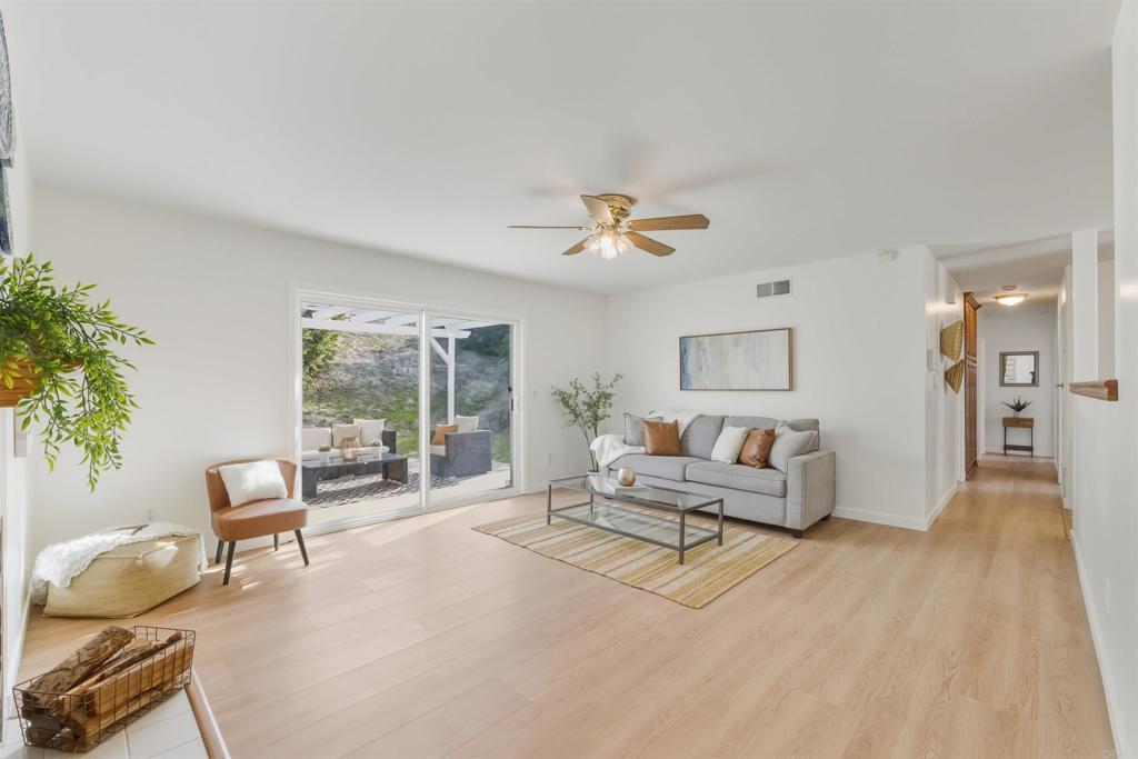 9909 Halberns Boulevard Santee, CA 92071 - Photo 4 of 35 a living room with furniture and a large window