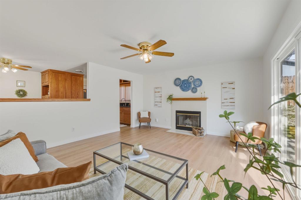 9909 Halberns Boulevard Santee, CA 92071 - Photo 6 of 35 a living room with furniture a fireplace and a table