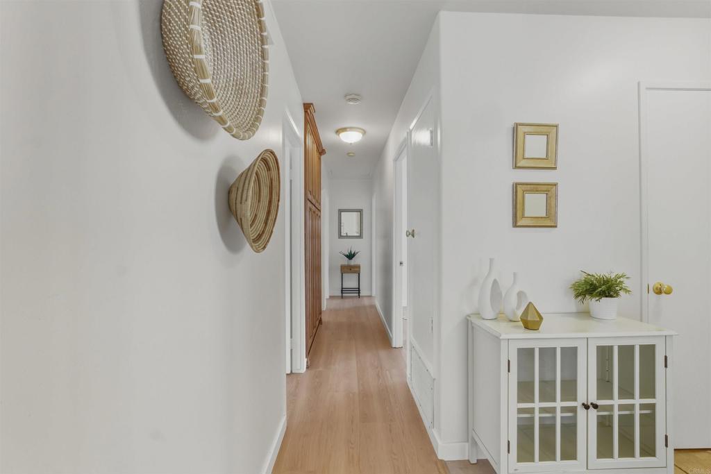 9909 Halberns Boulevard Santee, CA 92071 - Photo 9 of 35 a view of a hallway with wooden floor and entryway