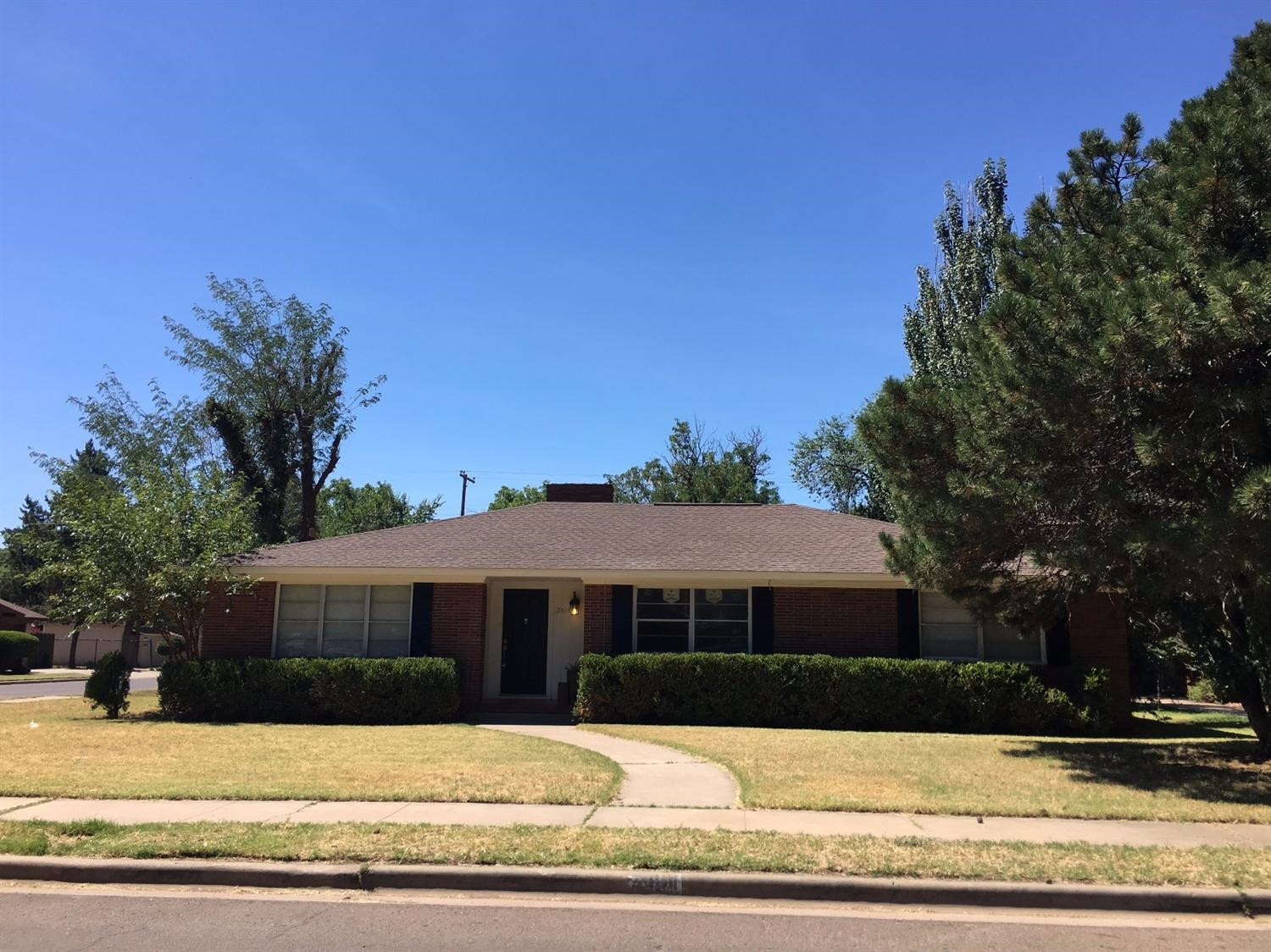 2801 20th Street Lubbock, TX 79410 - Photo 2 of 10 a front view of a house with a yard
