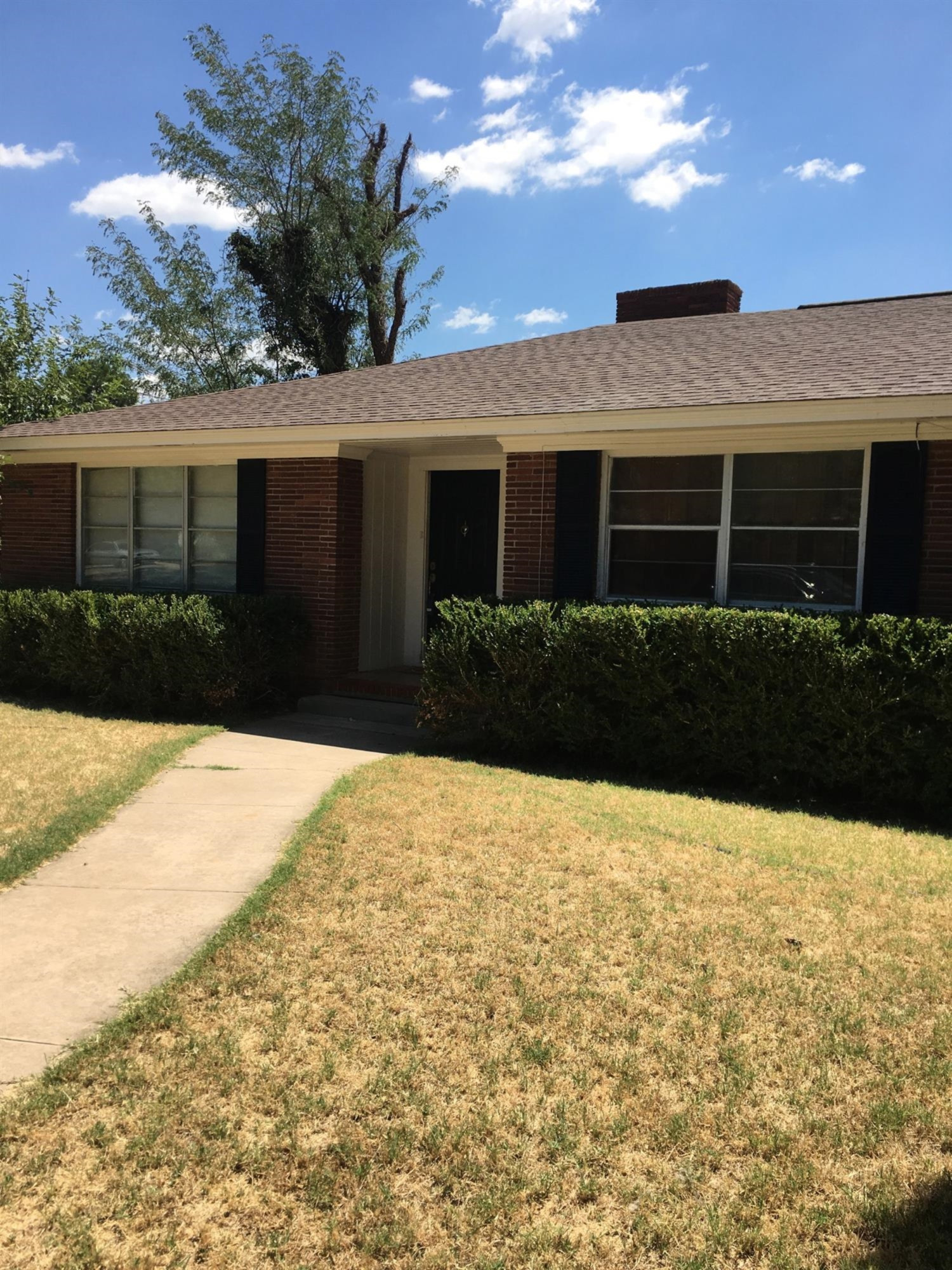 2801 20th Street Lubbock, TX 79410 - Photo 3 of 10 a front view of a house with a yard