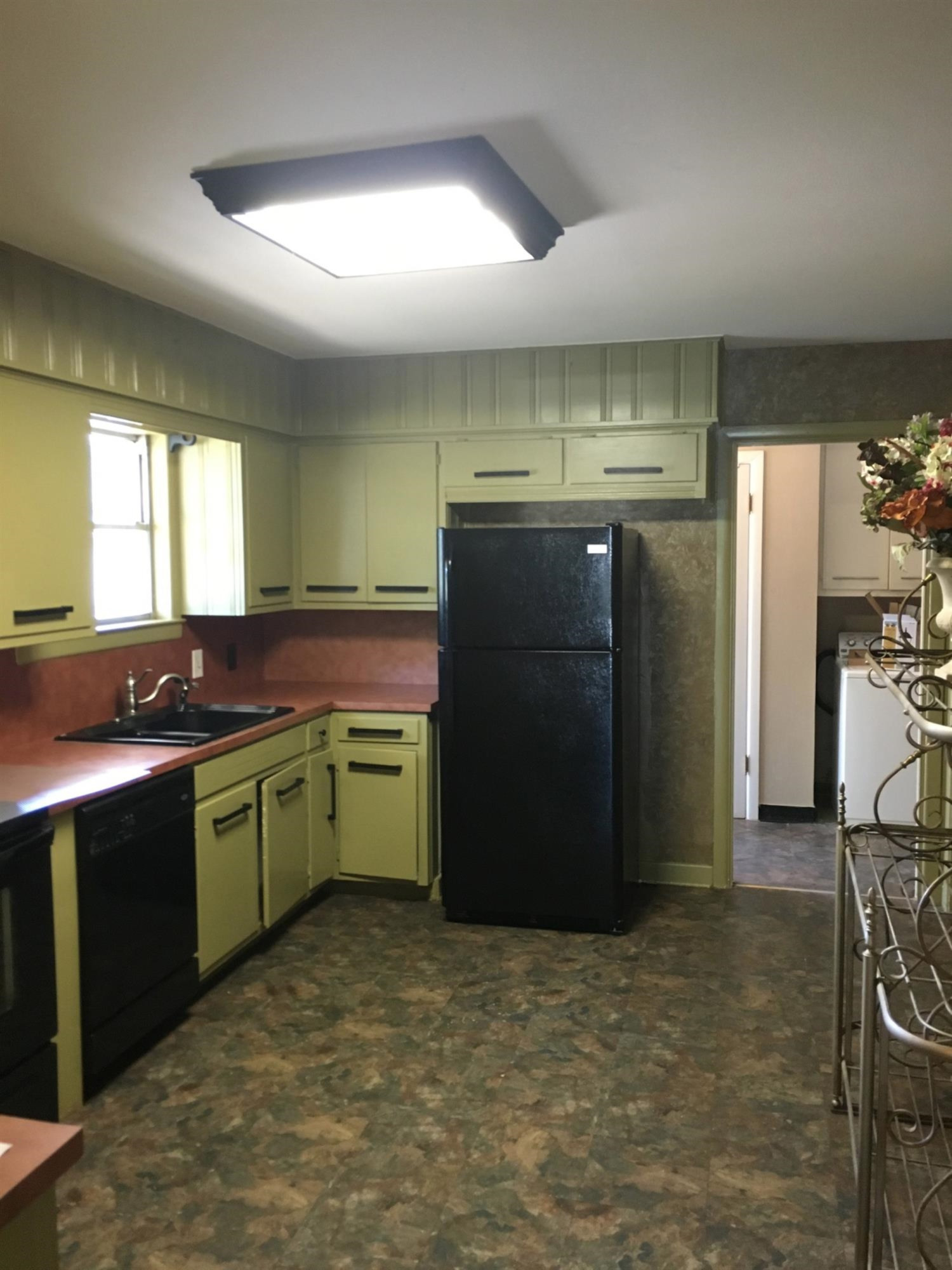2801 20th Street Lubbock, TX 79410 - Photo 10 of 10 a kitchen with a refrigerator and a sink