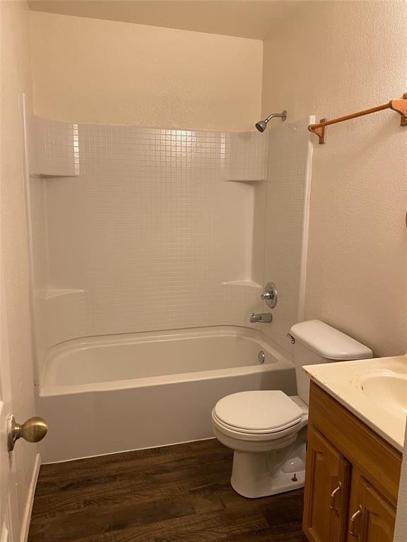 1110 Williams, Unit A Cleburne, TX 76033 - Photo 3 of 6 a bathroom with a toilet a sink and shower
