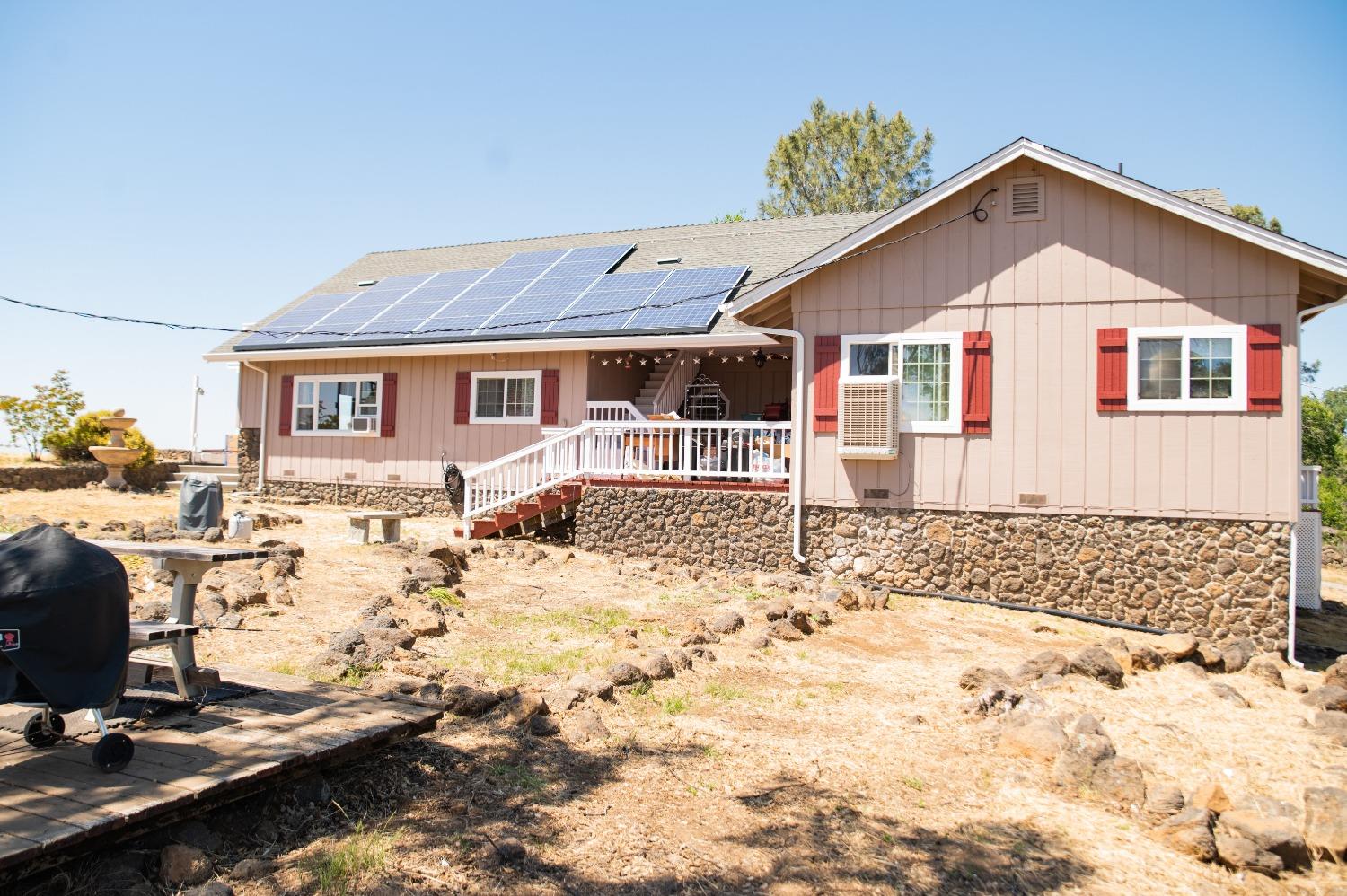 19900 Peppermint Falls Drive Sonora, CA 95370 - Photo 1 of 1 a front view of a house with a yard