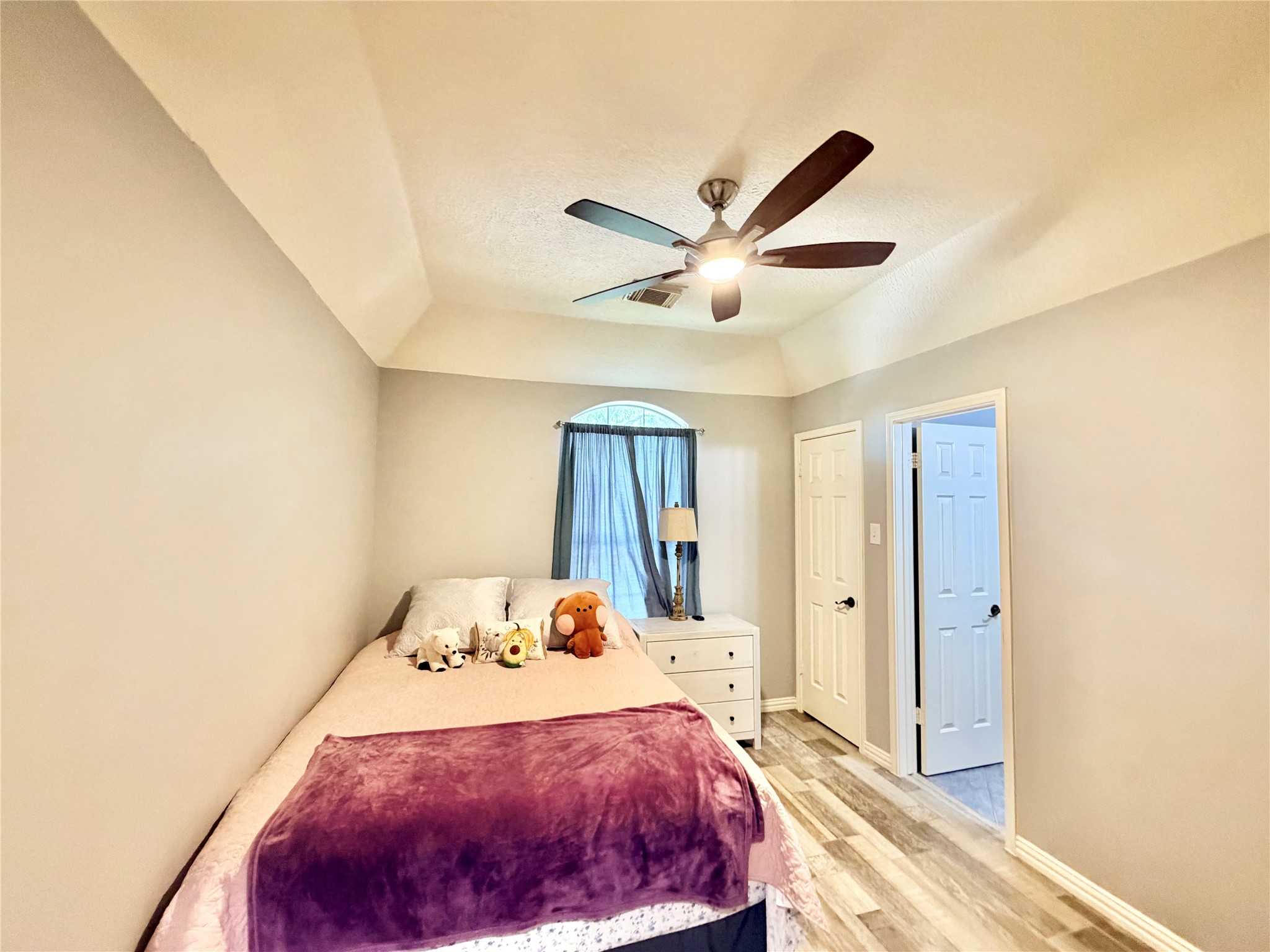 20110 Forest Drive Spring, TX 77388 - Photo 37 of 43 Bedroom 4 offers a cozy retreat with soft lighting, a stylish ceiling fan, and ample storage, perfect for comfort and relaxation.