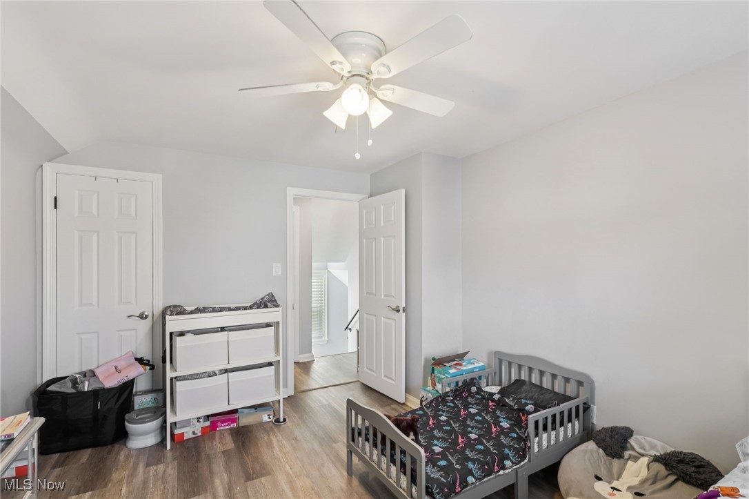 1503 Oakmount Road South Euclid, OH 44121 - Photo 27 of 50 Bedroom featuring wood finished floors, a nursery area, and ceiling fan