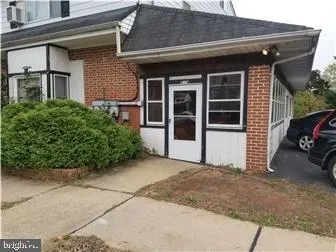 a view of a car parked front of a building