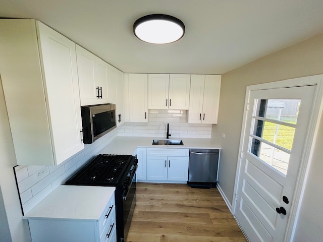 768 North Rohde Avenue Hillside, IL 60162 - Photo 4 of 20 a kitchen with granite countertop a sink and a stove top oven