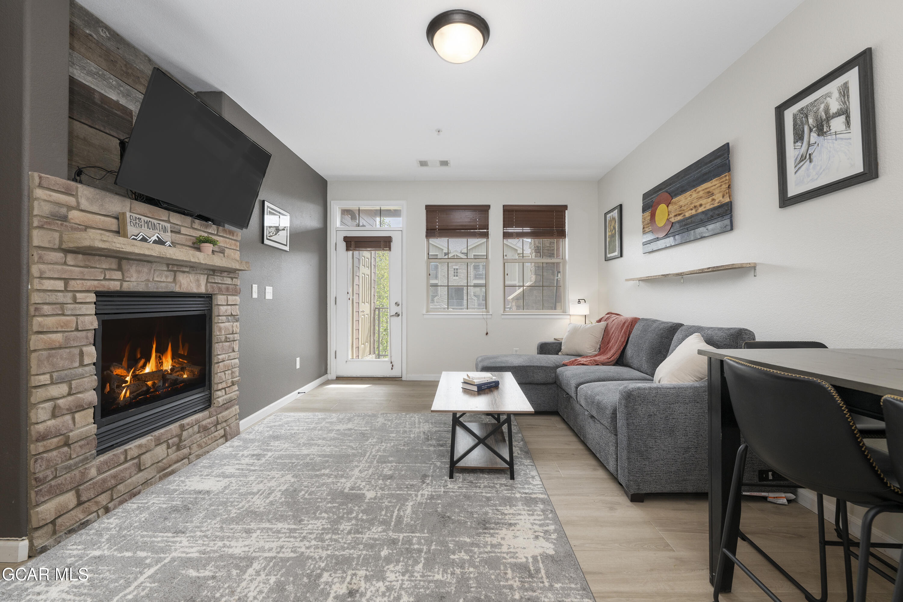 158 Village Road Granby, CO 80446 - Photo 1 of 46 a living room with furniture and a fireplace