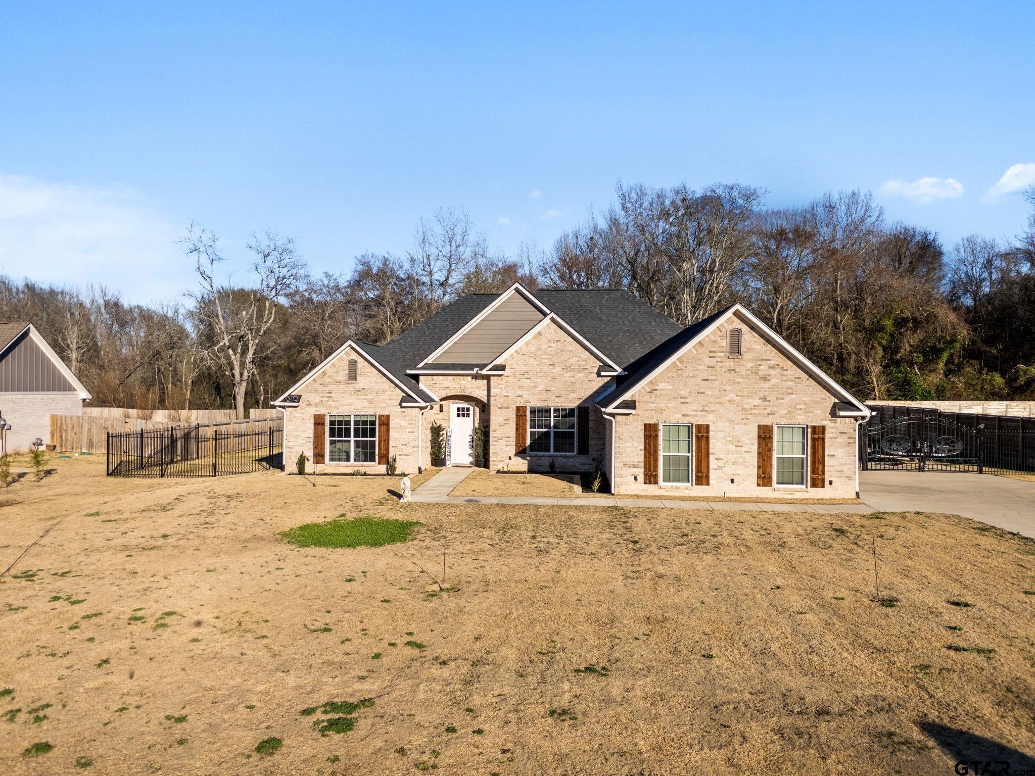 14543 Fallow Lane Tyler, TX 75706 - Photo 2 of 32 front view of a house with a yard