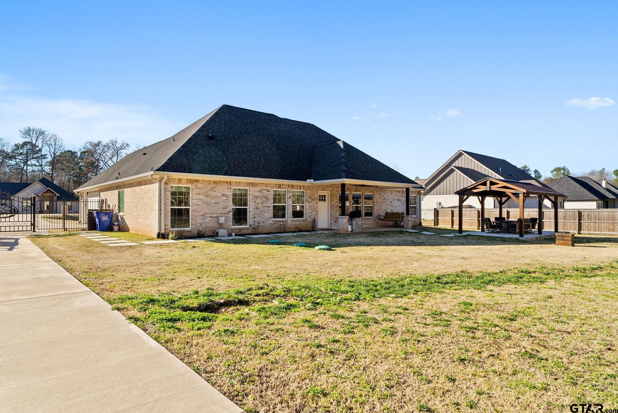 14543 Fallow Lane Tyler, TX 75706 - Photo 3 of 32 a front view of a house with a yard