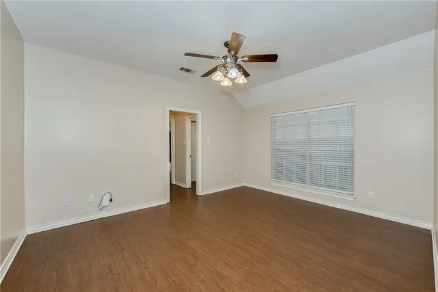 a view of an empty room with a window
