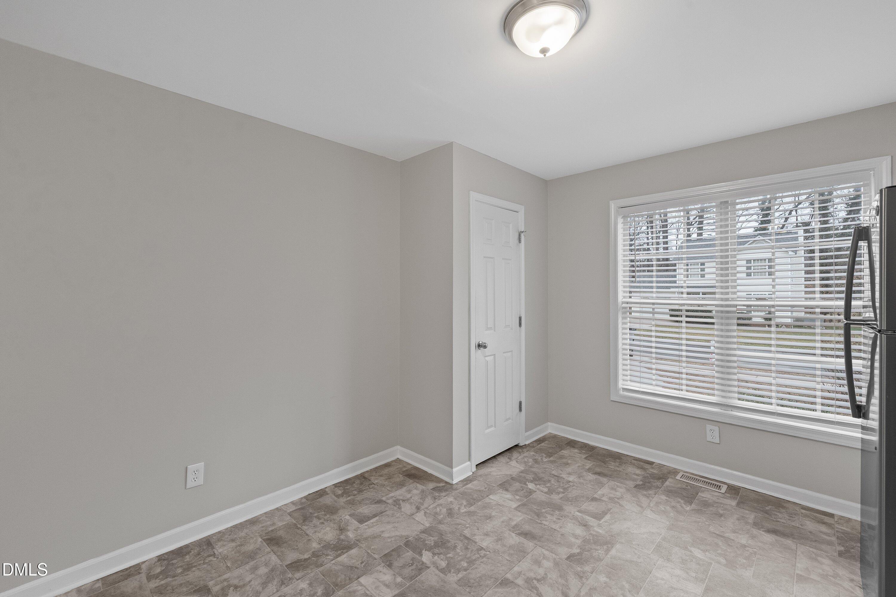 140 Melksham Road Wake Forest, NC 27587 - Photo 15 of 34 a view of an empty room with a window