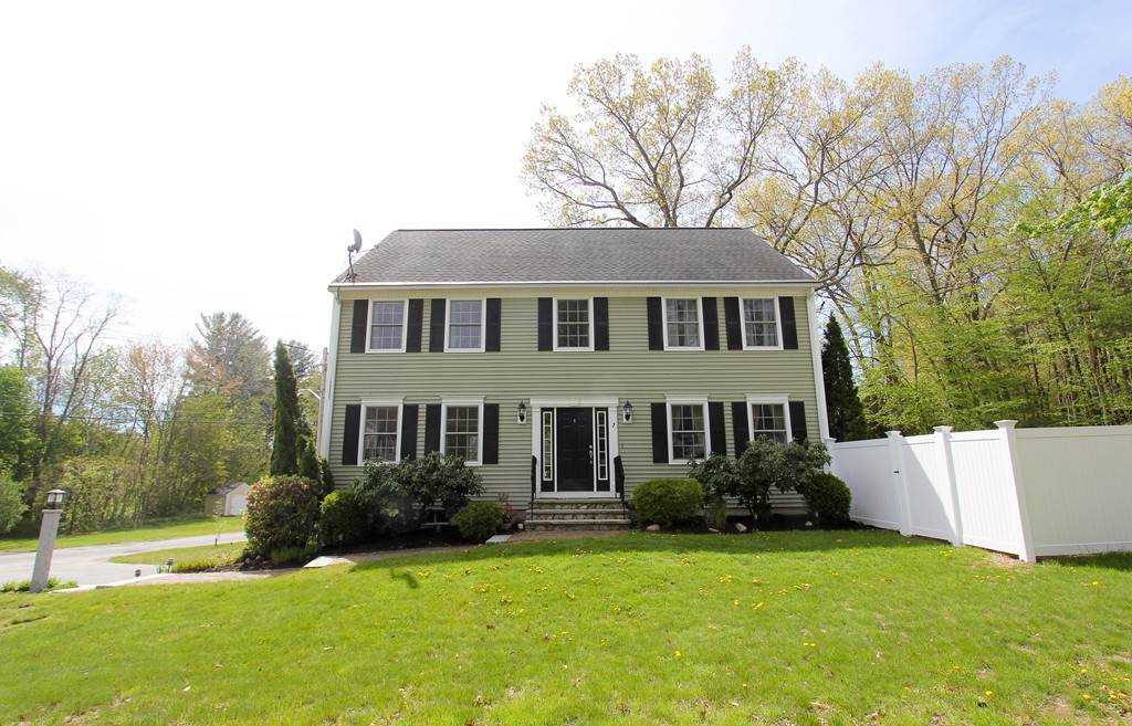 7 Middle Road Amesbury, MA 01913 - Photo 1 of 25 a front view of a house with a yard