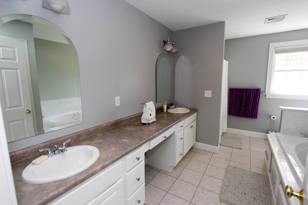 7 Middle Road Amesbury, MA 01913 - Photo 12 of 25 a bathroom with a granite countertop sink and a mirror