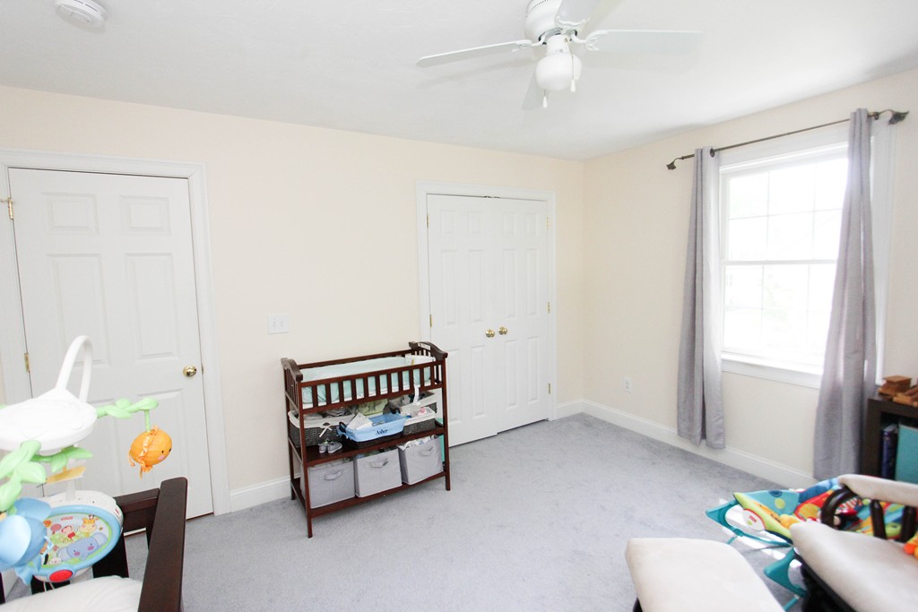 7 Middle Road Amesbury, MA 01913 - Photo 16 of 25 a bedroom with a bed and a window