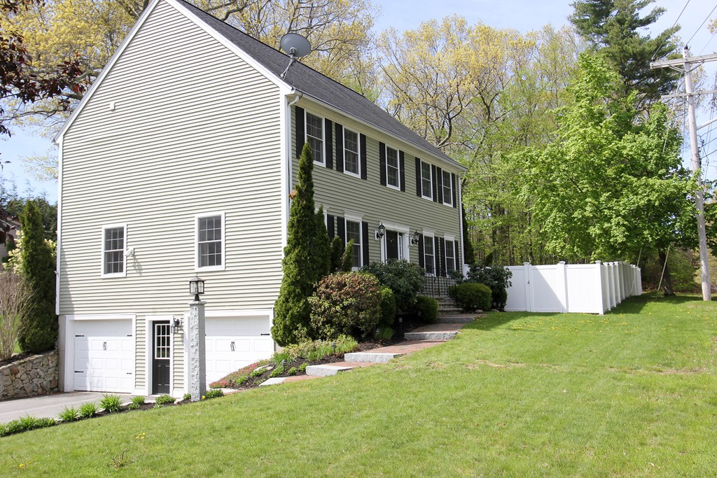 7 Middle Road Amesbury, MA 01913 - Photo 2 of 25 a view of a house with a yard and plants