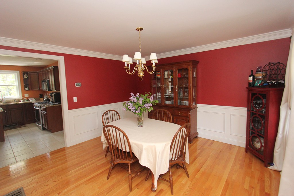 7 Middle Road Amesbury, MA 01913 - Photo 5 of 25 a view of a dining room with furniture and chandelier