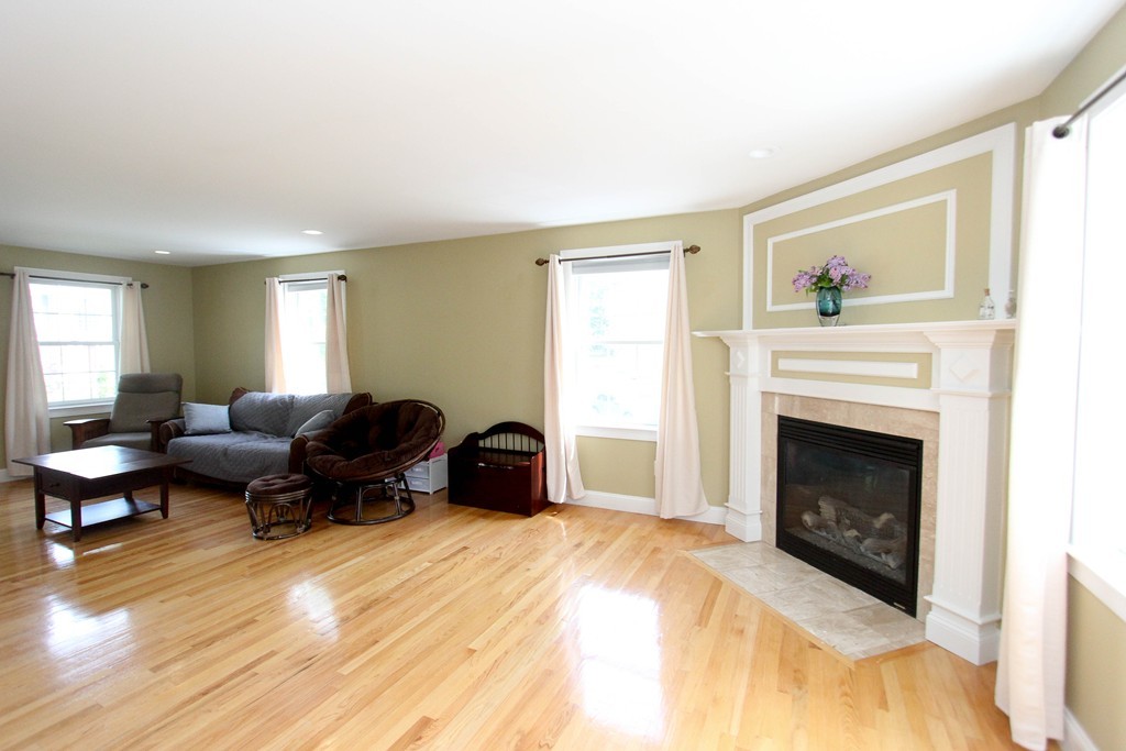 7 Middle Road Amesbury, MA 01913 - Photo 7 of 25 a living room with furniture and a fireplace