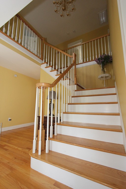 7 Middle Road Amesbury, MA 01913 - Photo 9 of 25 a view of entryway with wooden floor and a front door