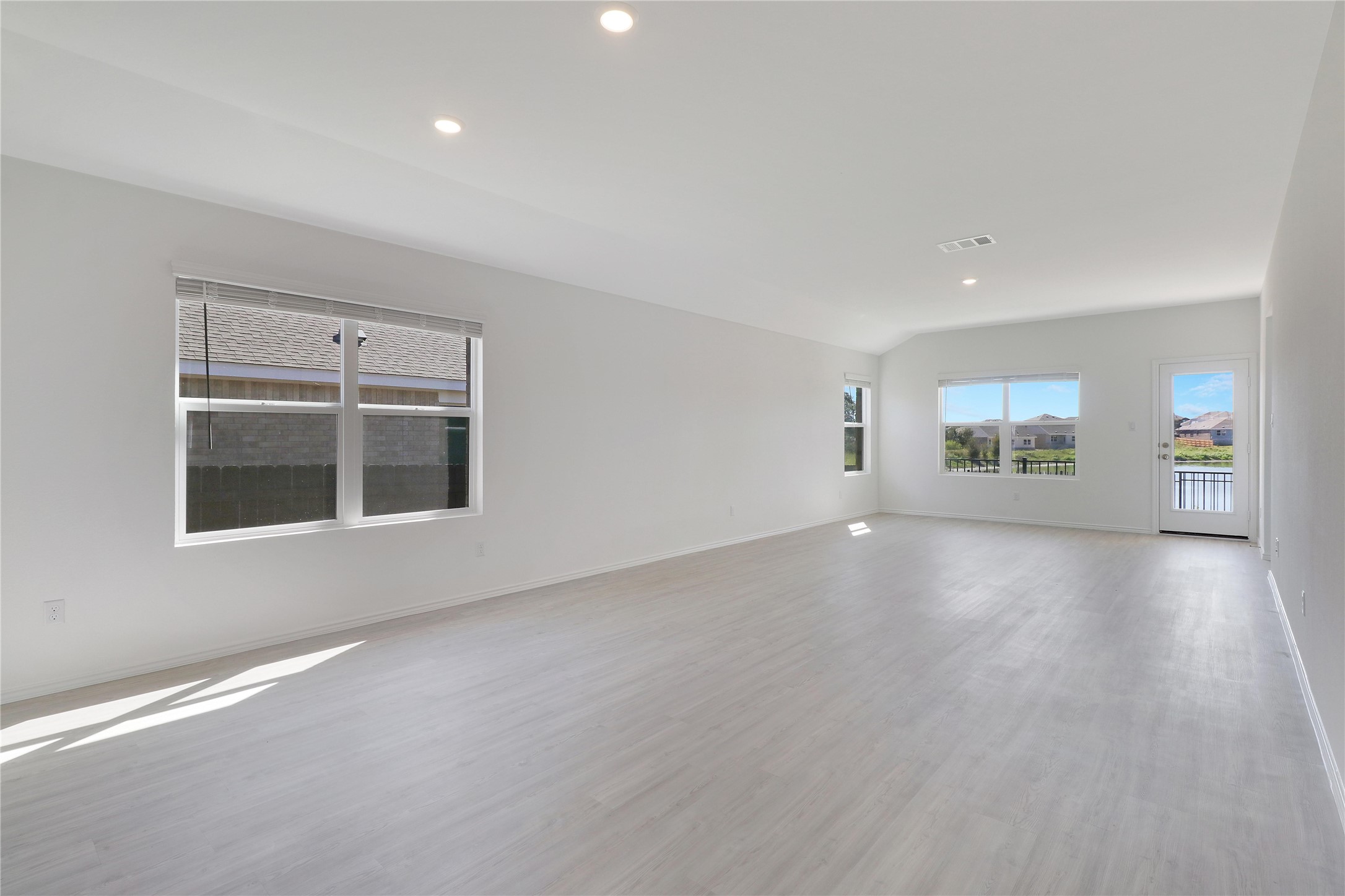 2524 Four Waters Loop Georgetown, TX 78628 - Photo 4 of 36 an empty room with windows and entrance