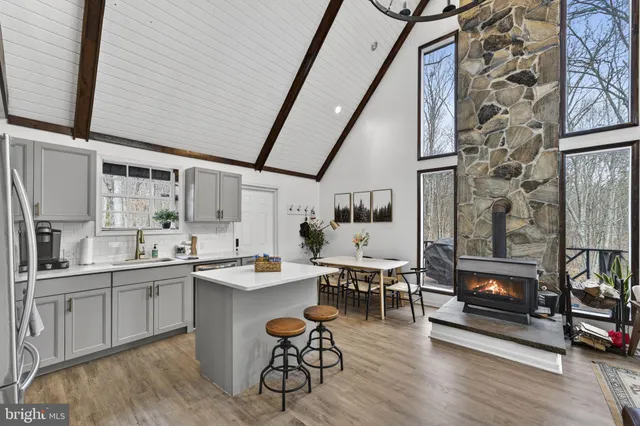a bedroom with a bed and a potted plant