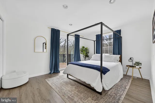 a view of balcony with wooden floor and outdoor seating