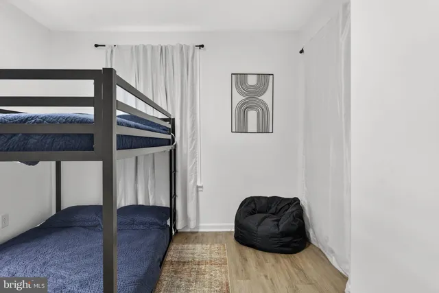 a backyard of a house with barbeque oven table and chairs