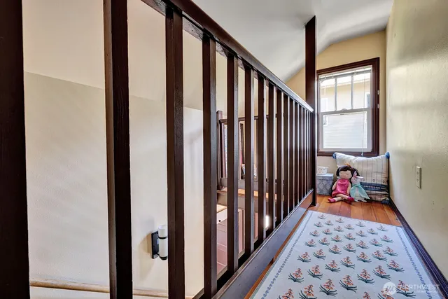 a bedroom with bed and a window