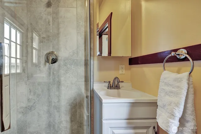 a bathroom with a sink and mirror