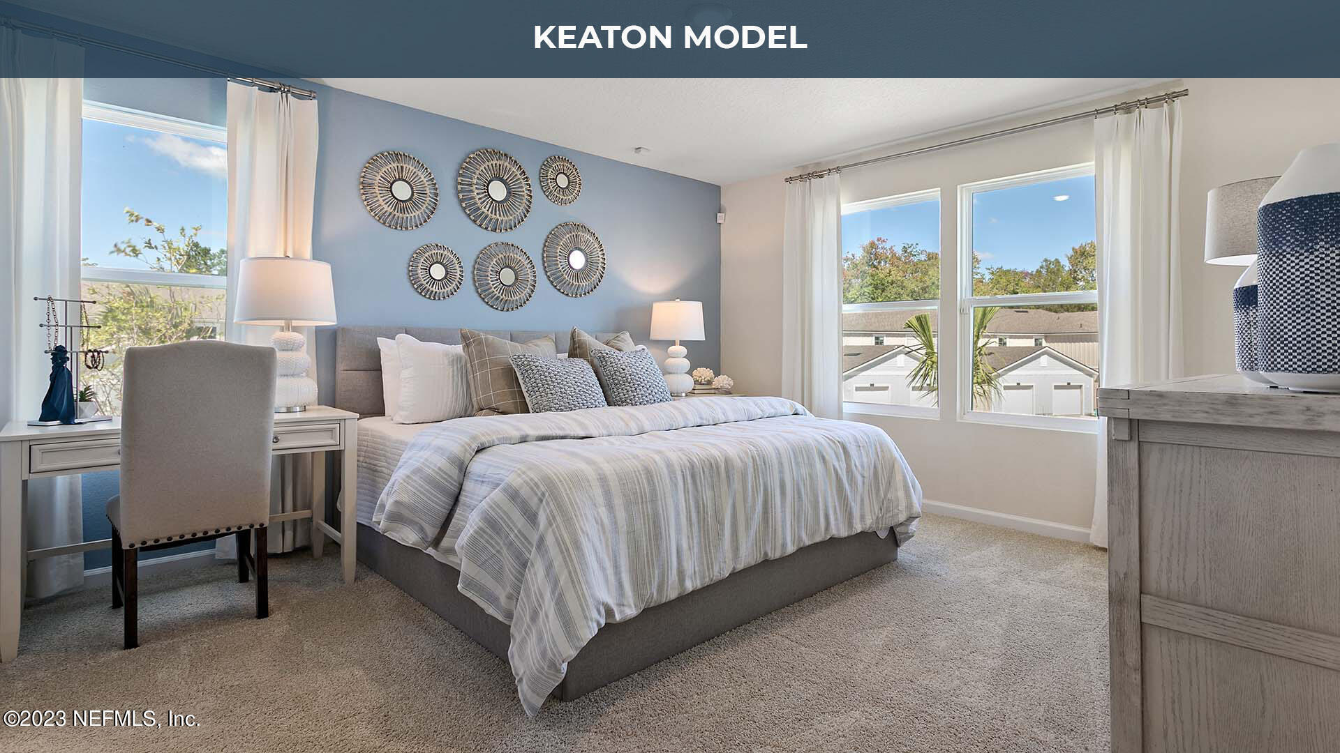 142 Seaport Breeze Road St. Augustine, FL 32095 - Photo 12 of 34 a bedroom with a bed lamp and a large window