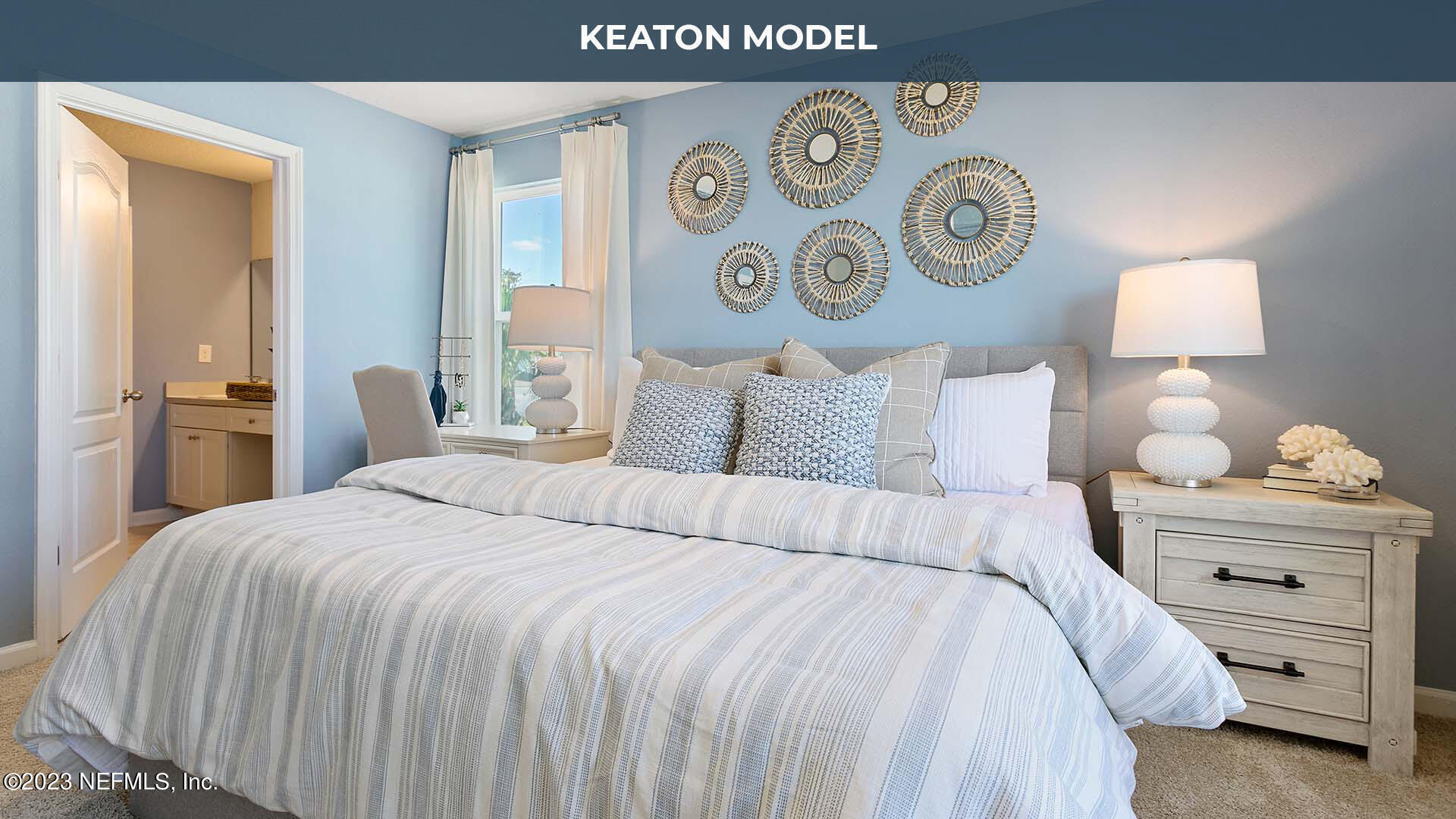142 Seaport Breeze Road St. Augustine, FL 32095 - Photo 13 of 34 a bedroom with a bed and a lamp