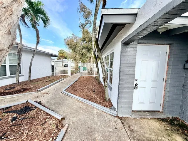 a view of a house with a snow in a yard