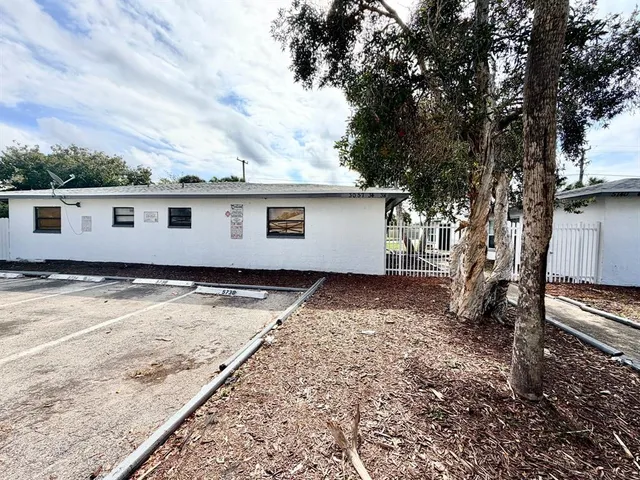 a backyard of a house with lots of green space