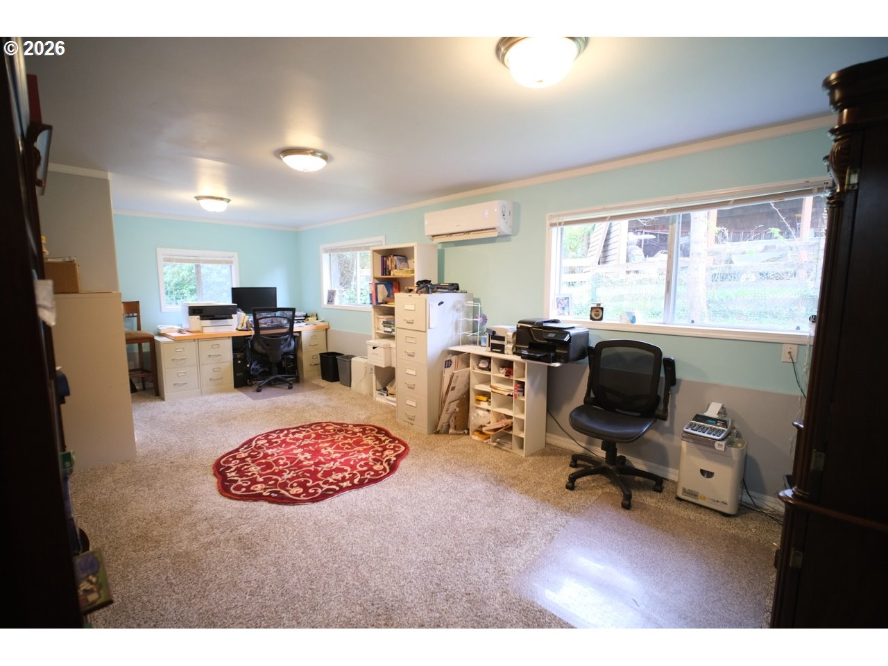 70214 Lakewood Road North Bend, OR 97459 - Photo 23 of 39 a view of a livingroom with workspace and a window