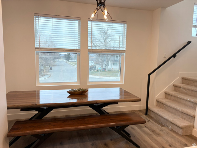 545 East 7215 South Midvale, UT 84047 - Photo 9 of 27 Dining area featuring light wood-style flooring and a chandelier