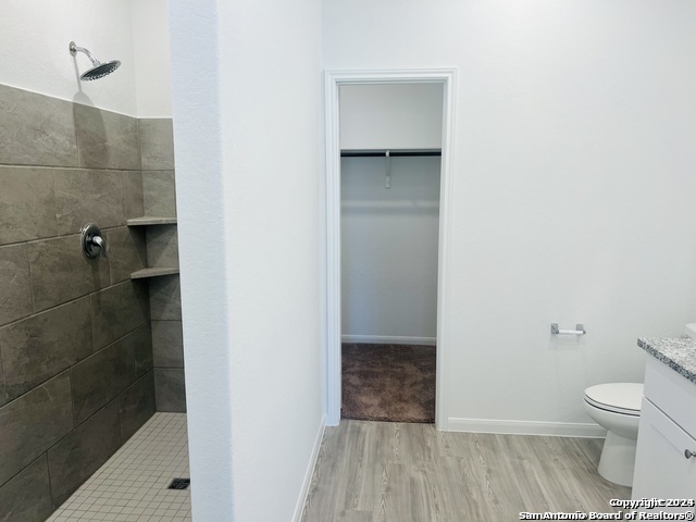 32141 Morels Avenue Bulverde, TX 78163 - Photo 11 of 22 a bathroom with a toilet and a shower