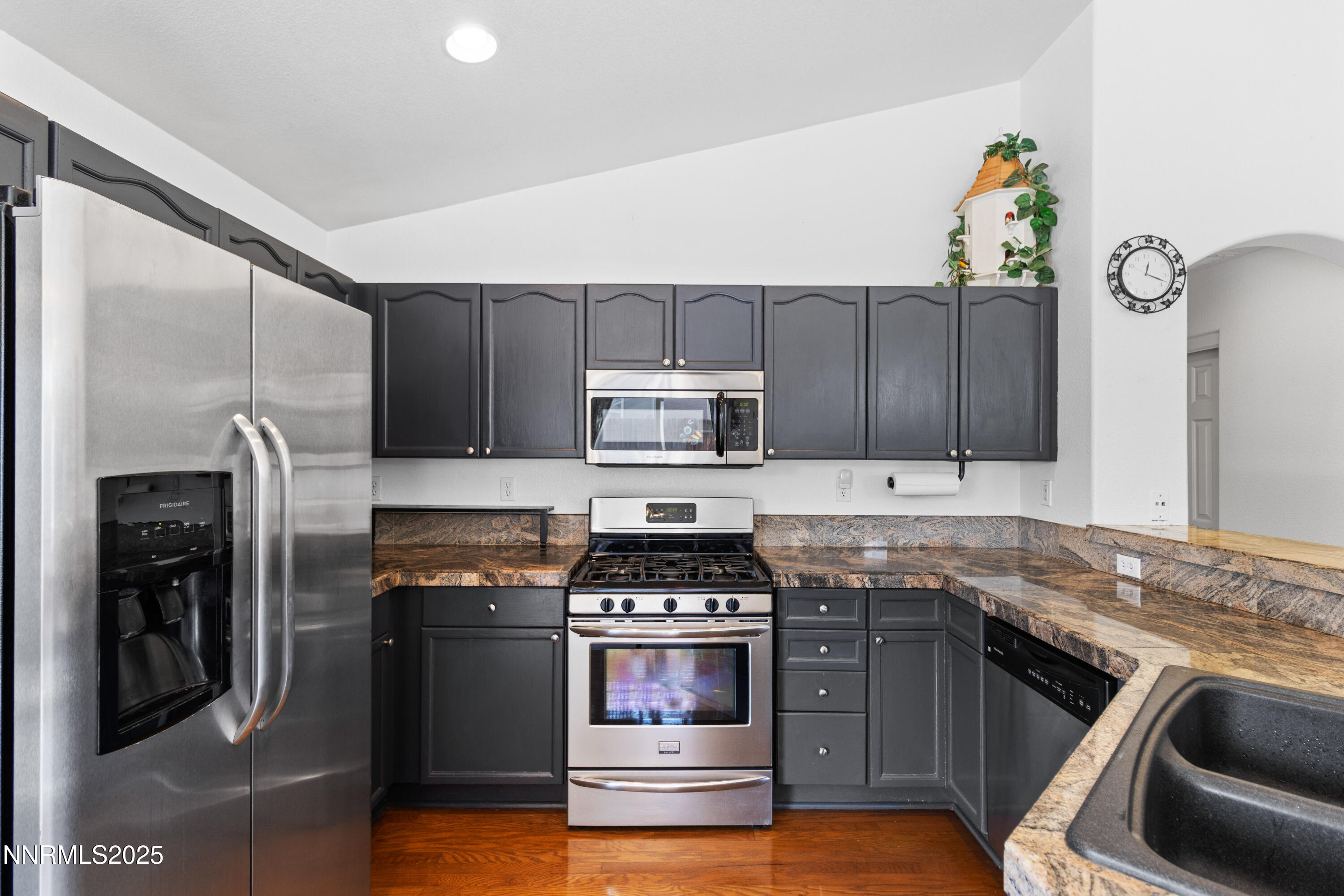 10375 Rosemount Drive Reno, NV 89521 - Photo 14 of 29 a kitchen with stainless steel appliances granite countertop a stove and a refrigerator