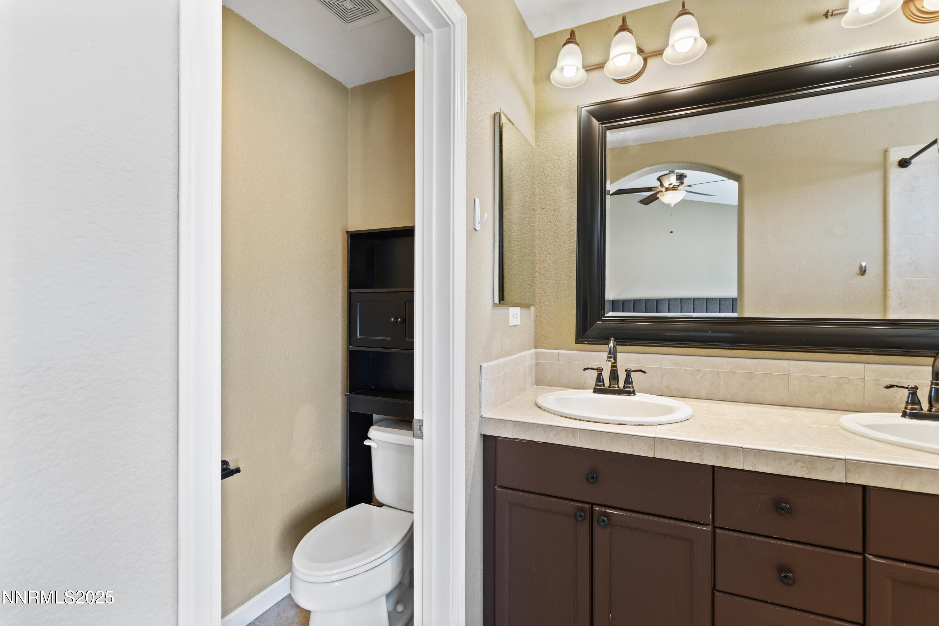 10375 Rosemount Drive Reno, NV 89521 - Photo 16 of 29 a bathroom with a sink and a mirror