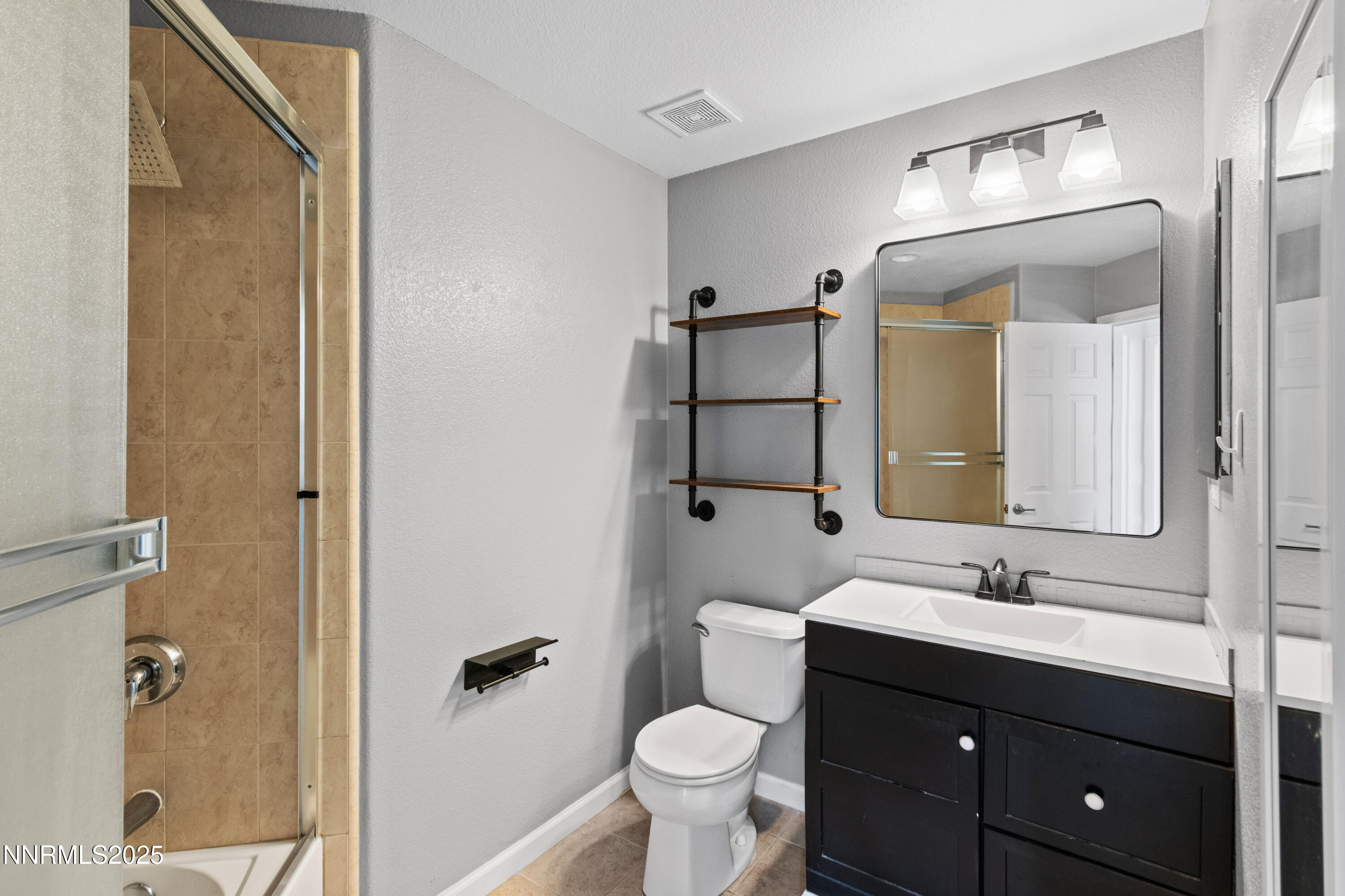 10375 Rosemount Drive Reno, NV 89521 - Photo 20 of 29 a bathroom with a sink vanity and a toilet