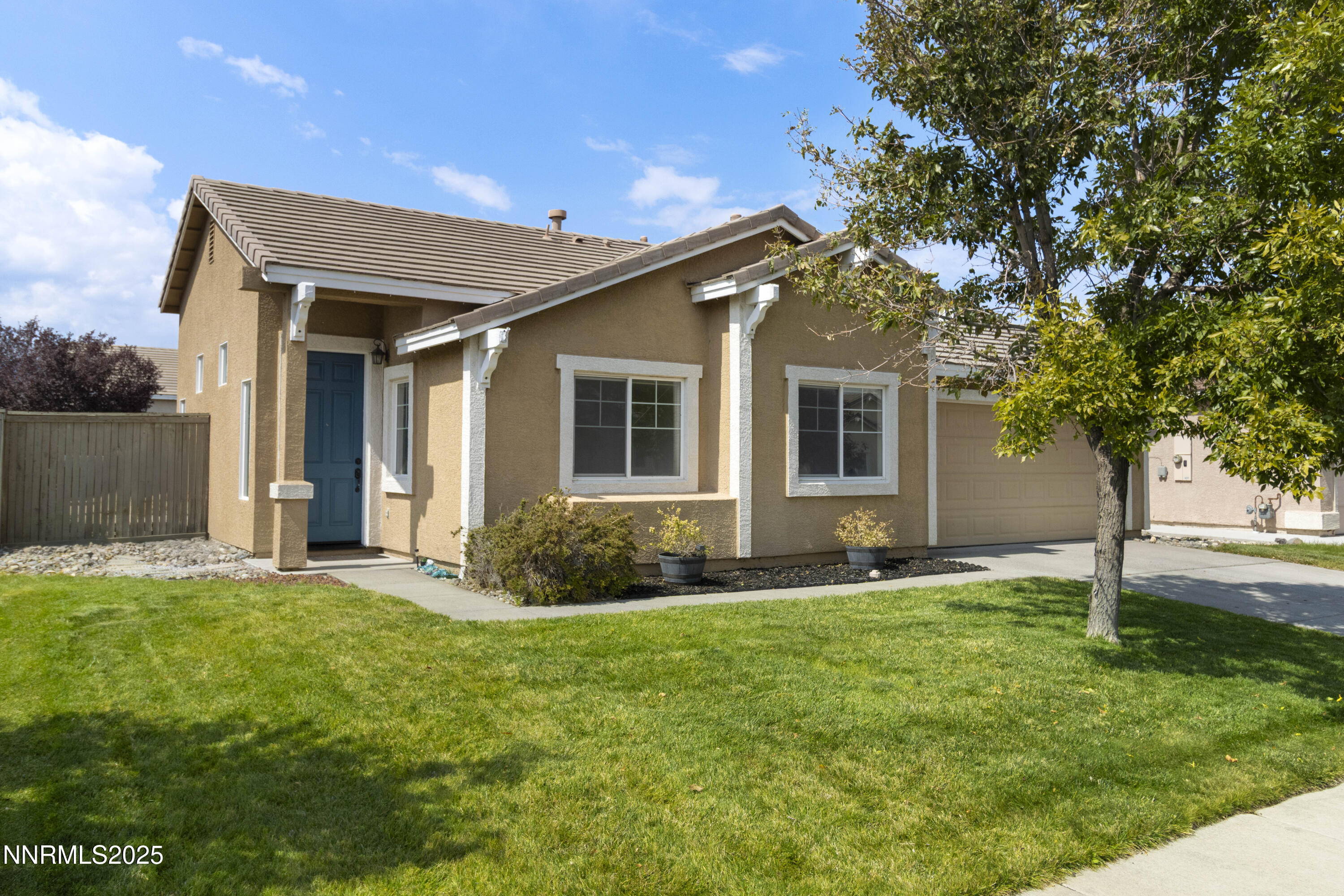 10375 Rosemount Drive Reno, NV 89521 - Photo 2 of 29 a front view of a house with a yard