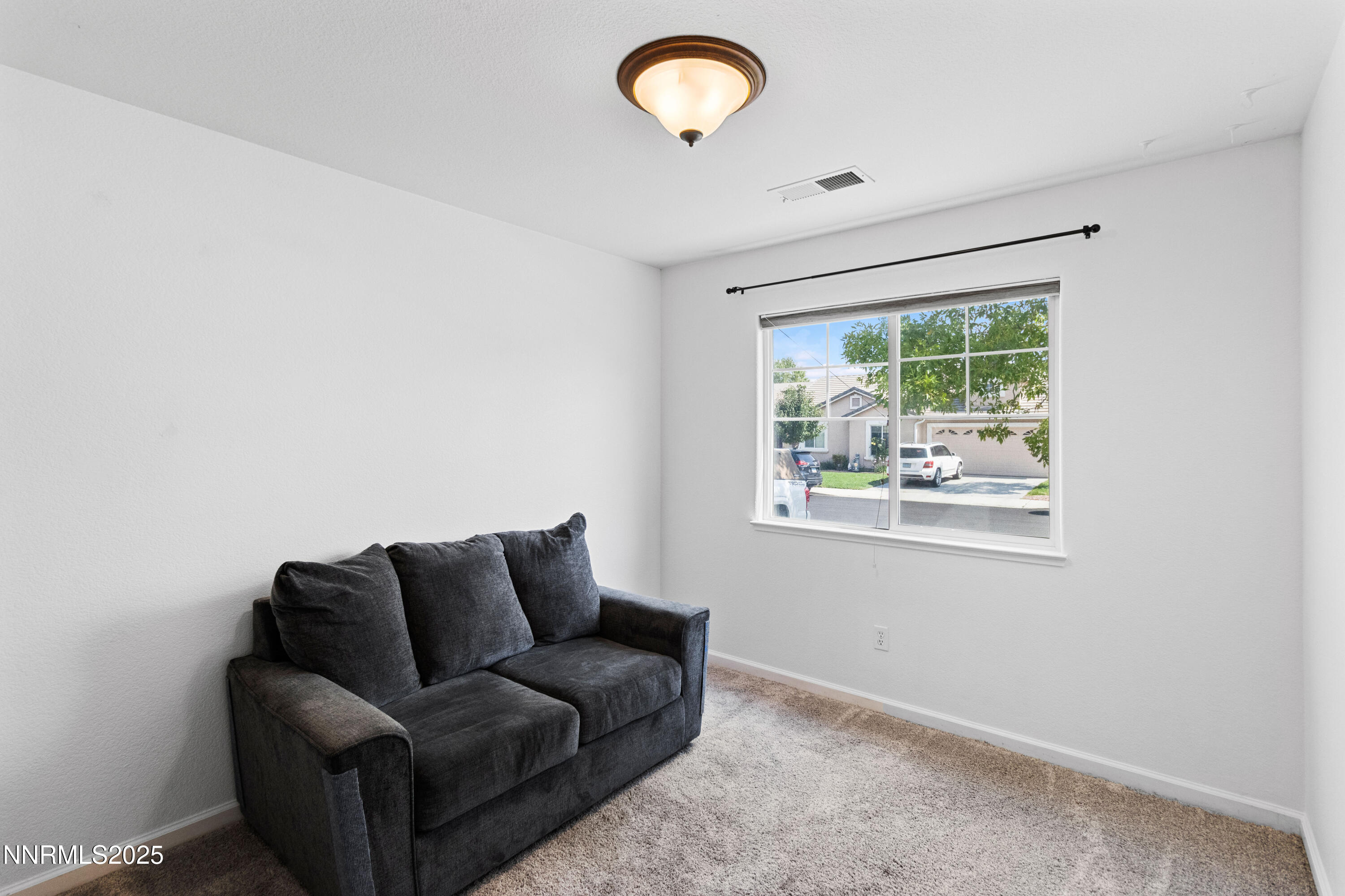 10375 Rosemount Drive Reno, NV 89521 - Photo 22 of 29 a living room with furniture and a window