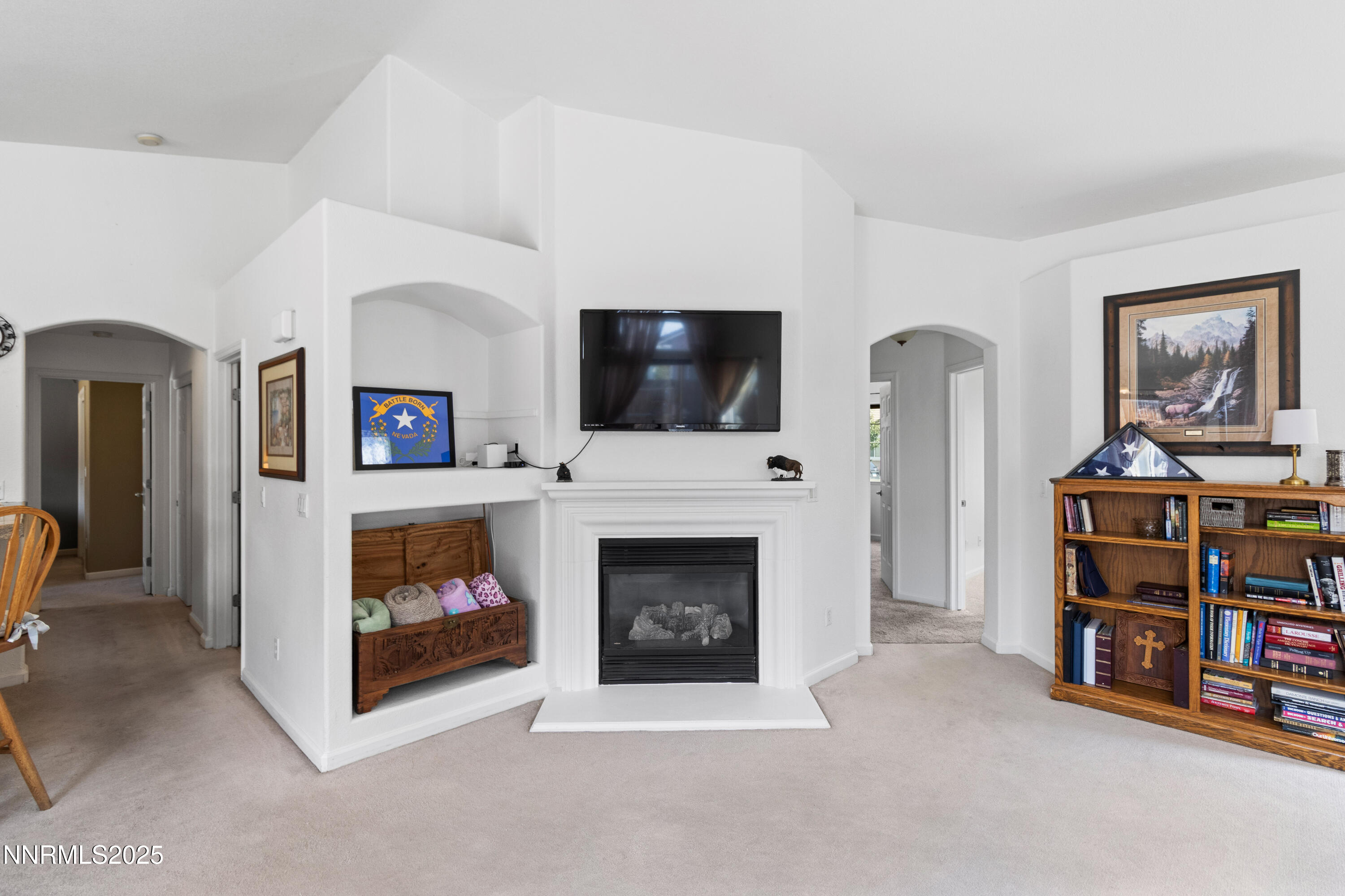 10375 Rosemount Drive Reno, NV 89521 - Photo 8 of 29 a living room with furniture a fireplace and a flat screen tv