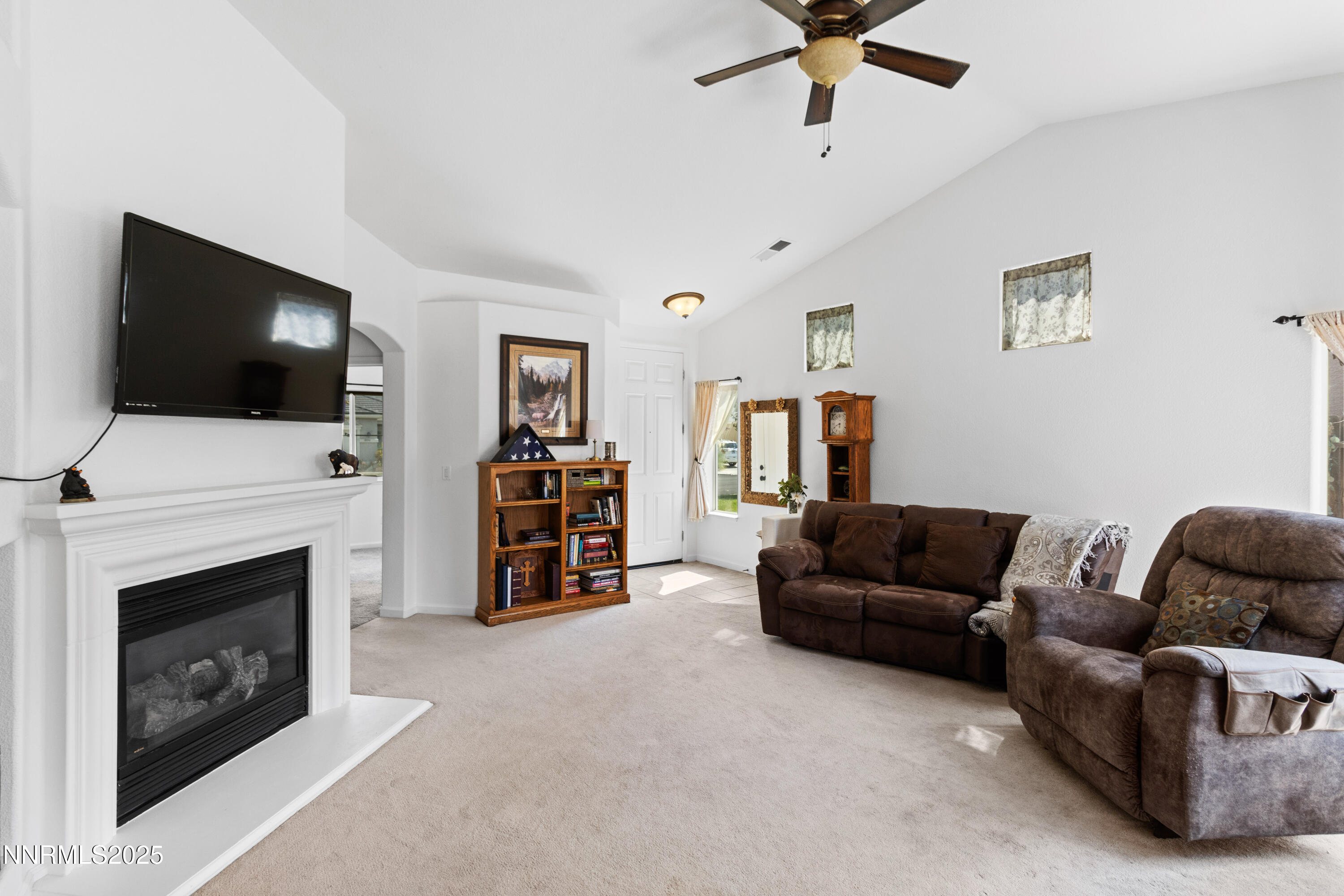 10375 Rosemount Drive Reno, NV 89521 - Photo 9 of 29 a living room with furniture and a flat screen tv